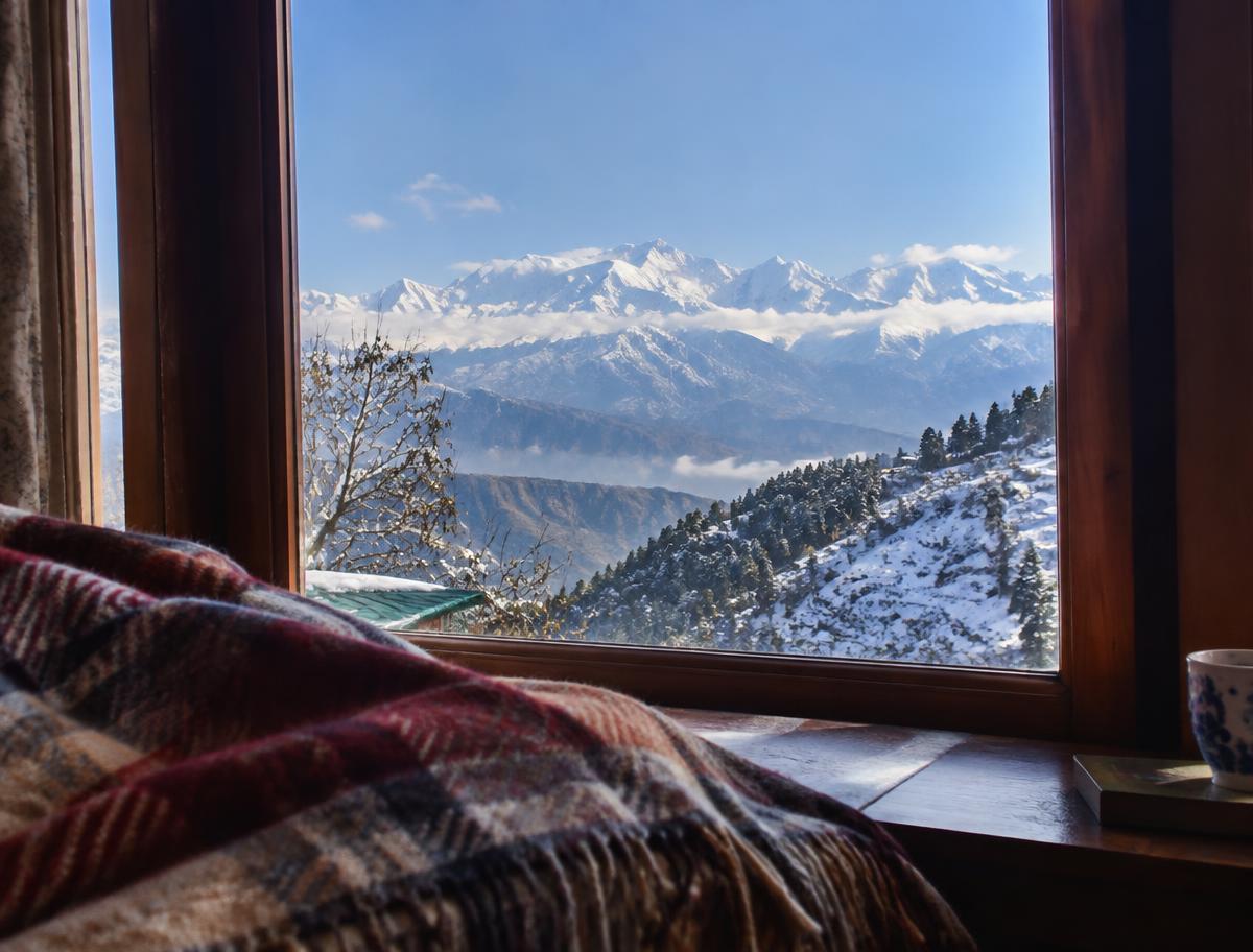 Snow-capped peaks seen from a homestay window